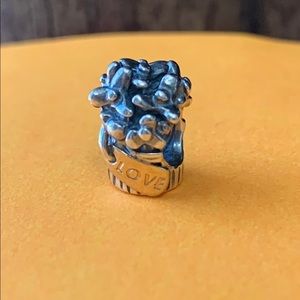 Pandora charm with gold tag.
